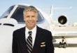 Pilot in Front of Private Jet --- Image by © Royalty-Free/Corbis